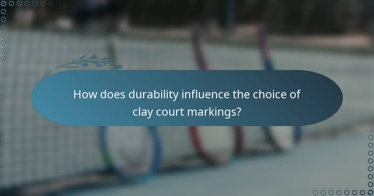 How does durability influence the choice of clay court markings?